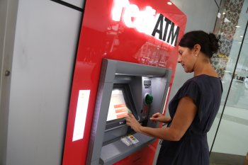 Young woman at a rediATM